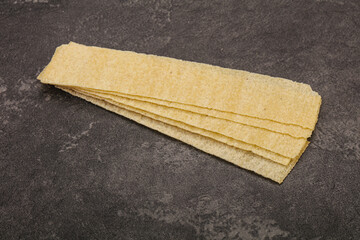 Natural salted potato chips heap