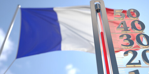 Thermometer shows high air temperature against blurred flag of France. Hot weather forecast related 3D rendering