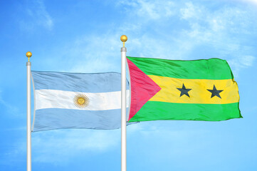 Argentina and Sao Tome and Principe two flags on flagpoles and blue sky