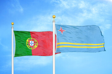 Naklejka na ściany i meble Portugal and Aruba two flags on flagpoles and blue sky