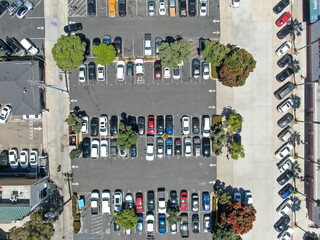 Aerial top view of parking lot with varieties of colored vehicles. Pacific Beach. California