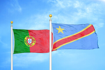 Portugal and Congo Democratic Republic two flags on flagpoles and blue sky