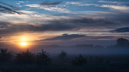Fototapeta na wymiar sunrise over the countryside, mist, fog, blue sky, landscape, Poland, Europe