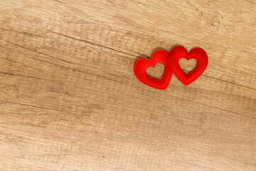 couple of hearts red symbol of love wooden background base copy space on wooden background