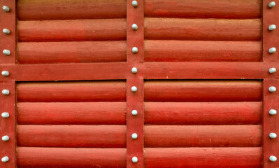red log wall wooden horizontal logs part of the wall of the protective fort