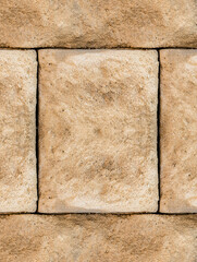 old gray stone part of the wall solid close-up vertical block base design