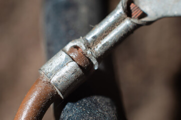 Clamp of wire in quick-release connector close-up, macro shot