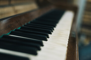 keyboard of an old upright piano
