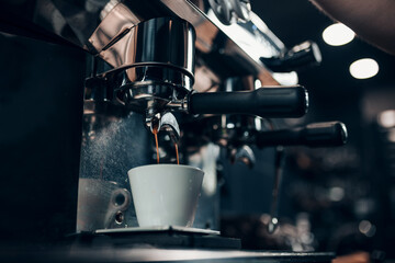 The art of barista in making coffee - professional brewing on expensive equipment