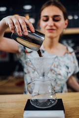The art of barista in making coffee - professional brewing on expensive equipment