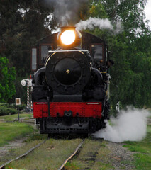 Naklejka premium TRANSPORTATION- Steam Train Arriving at the Station