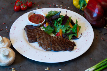 Delicious food on a grey table