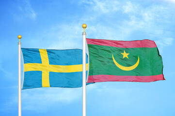 Sweden and Mauritania two flags on flagpoles and blue sky