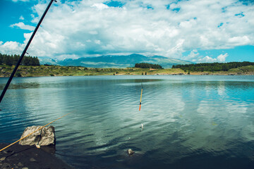 fishermen fishing by the lake
