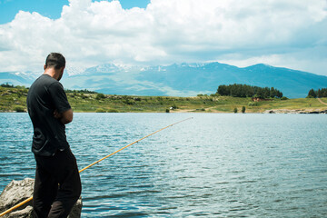 Fototapeta na wymiar fishermen fishing by the lake