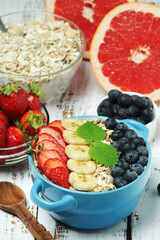 Healthy diet breakfast including cereal with berry and fruits