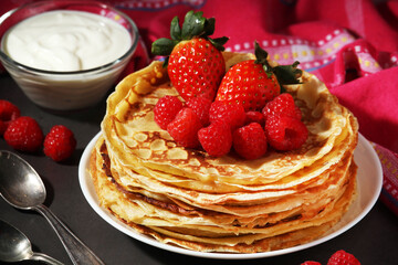 Russian cuisine national dish bliny with fresh berries