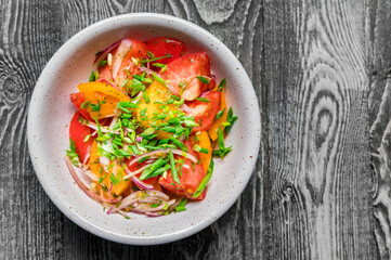 Fresh rustic vegetable salad on rustic background