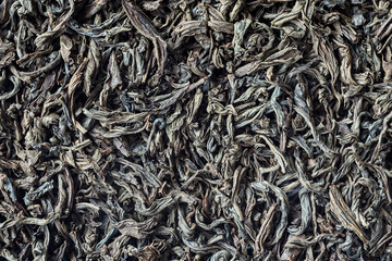Full frame of Azerbaijan traditional tea. Black tea texture close up for background. Top view of dried tea leaves