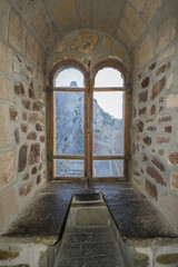 Old castle window overlooking the fortress, middle ages