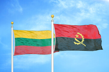 Lithuania and Angola two flags on flagpoles and blue sky