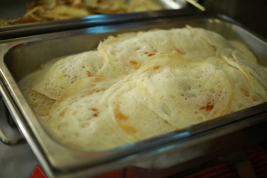 Appam, Palappam,Kallappam,vella appam,parotta,Roti or Chapati a popular traditional Kerala breakfast food.