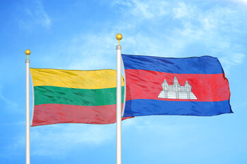 Lithuania and Cambodia two flags on flagpoles and blue sky
