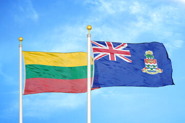 Lithuania and Cayman Islands two flags on flagpoles and blue sky