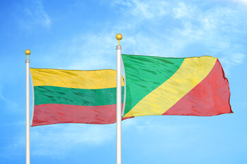Lithuania and Congo two flags on flagpoles and blue sky