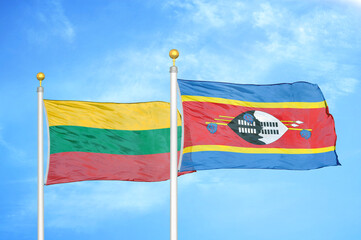 Lithuania and Eswatini Swaziland two flags on flagpoles and blue sky