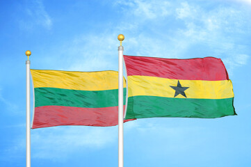 Lithuania and Ghana two flags on flagpoles and blue sky