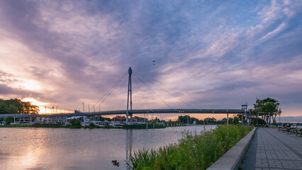 Fototapeta premium Modern pedestrian bridge In Gizycko Port during sunrise, Poland.
