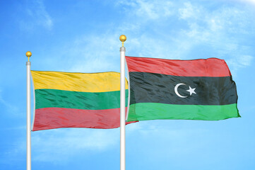 Lithuania and Libya two flags on flagpoles and blue sky