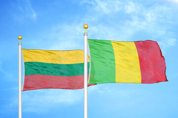 Lithuania and Mali two flags on flagpoles and blue sky