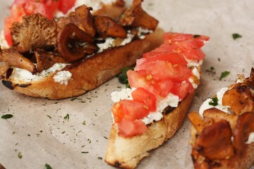 Bruschetta with red tomatoes and chanterelles macro