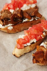 Bruschetta with red tomatoes and chanterelles macro