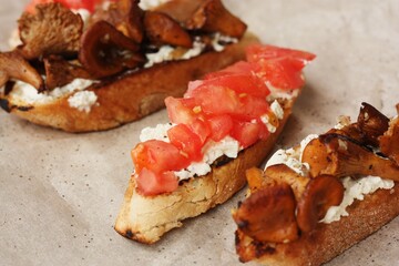 Bruschetta with red tomatoes and chanterelles macro