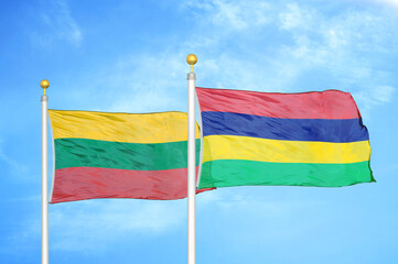 Lithuania and Mauritius two flags on flagpoles and blue sky