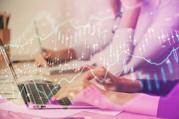 Multi exposure of woman hands typing on computer and financial chart hologram drawing. Stock market analysis concept.