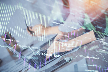 Multi exposure of woman hands typing on computer and financial chart hologram drawing. Stock market analysis concept.