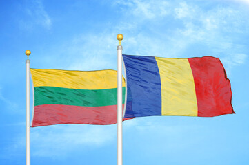 Lithuania and Romania two flags on flagpoles and blue sky