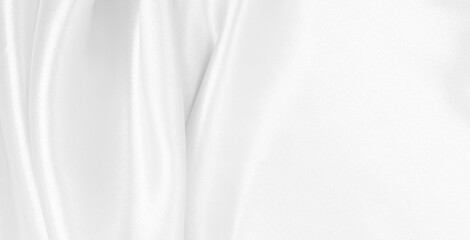 Smooth elegant white silk or satin luxury cloth texture as wedding background. Luxurious background design