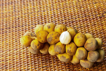 Longkong branch tropical fruits of Asia, many brown fruits with a white heart