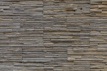mountain slate wall, light gray ribbed uneven hard and weathered