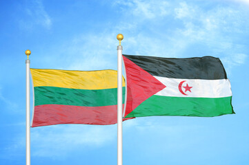 Lithuania and Western Sahara two flags on flagpoles and blue sky