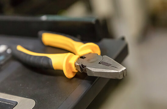 pliers yellow black rubber grips edge keyboard service repair
