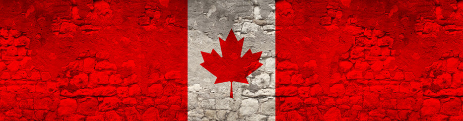 seamless panorama of the national flag of the state of Canada on an old stone wall with cracks, the concept of historical, tourism, emigration, economy, politics, global world trade