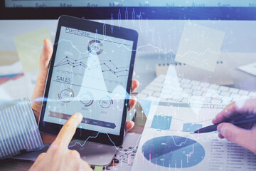 Multi exposure of man's hands holding and using a phone and financial chart drawing. Market analysis concept.