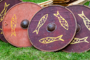 Naklejka premium set of traditional wooden shields, round red patterned fish, disposable for ostentatious fights
