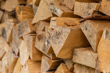 woodpile of chopped firewood pattern end of a log, fuel for a fireplace heating
